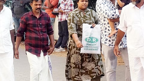 Nithin Raj’s father and sister at the Kannur Police Commissioner’s office.