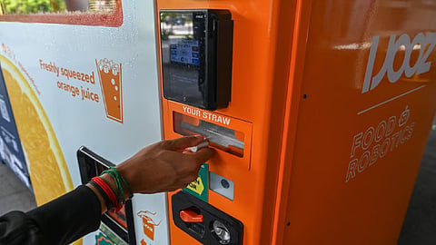French teen charged in Singapore over vending machine straw-licking video