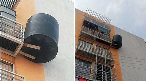 Instala tinaco en 5to piso y lo refuerza con lazo para que no se caiga