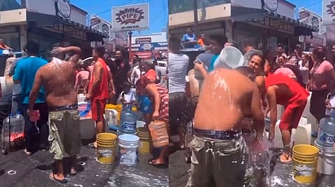 Aalgunas personas llenan cubetas y otros envases de agua para llevar a sus casas