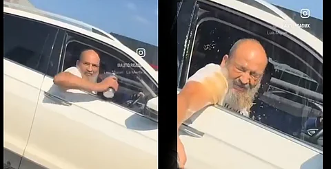 VIDEO: intentó lanzar café a un auto y terminó bañándose él mismo
