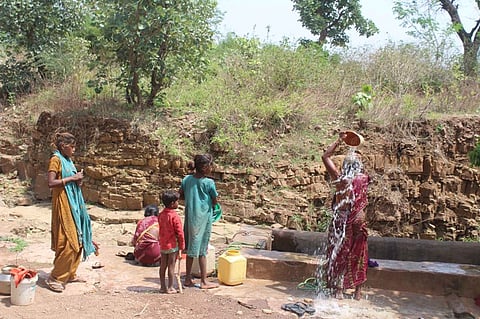 Santo Devi bathes at the well in Michkurin village, Bundelkhand (Image: Jigyasa Mishra)