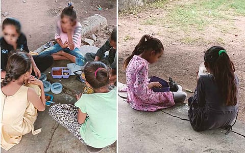 स्कूल में घर से लाया हुआ भोजन करते बच्चे