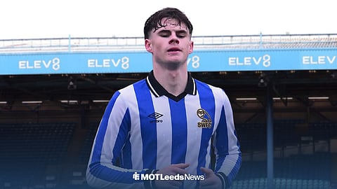 Harry Gray in a Sheffield Wednesday kit, with Hillsborough behind him