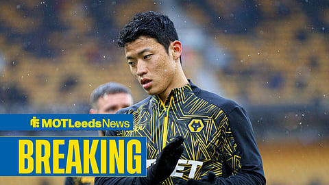 An image of Wolves striker Hwang Hee-chan warming up at Molineux