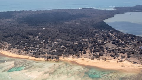 A general view from a New Zealand Defence Force P-3K2 Orion surveillance flight shows heavy ash fall over Nomuka in Tonga after the Pacific island nation was hit by a tsunami triggered by an undersea volcanic eruption January 17, 2022.
