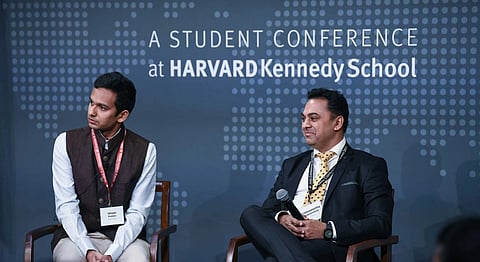 International Monetary Fund Executive Director Dr. Krishnamurthy Subramanian, right, and moderator Ishaan Poddar listen to the audience during a Q&A session following the keynote address by Dr. Subramanian at the India Conference at Harvard 2023 at Harvard Kennedy School in Cambridge, MA on Feb. 11, 2023.