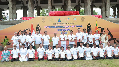 Dignitaries pose for a photograph with organizers at the event organized by the High Commission of India and Swami Vivekananda Cultural Centre in Colombo, Sri Lanka, to celebrate the 9th International Day of Yoga. 17 June 2023.