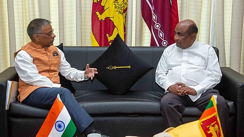 India's High Commissioner Gopal Baglay, left, speaks with Sri Lankan Speaker Mahinda Yapa Abeywardena at the Sri Lankan Parliament in Colombo on Aug. 23.