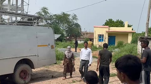 Kanpur Dehat Land Dispute Two Women Climb Water Tank to Protest Construction