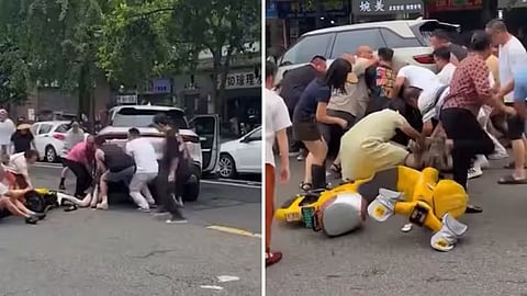 Around 30 people in China joined forces to lift an SUV and rescue a 14-year-old girl trapped underneath.
