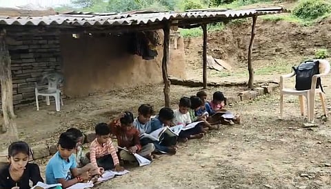 Children Studying Under a Tree and in a Tin Shed