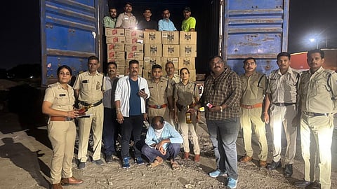 Indore Excise Department officials seize a container carrying Haryana-made liquor