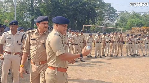 Khandwa police personnel conduct a riot-control parade