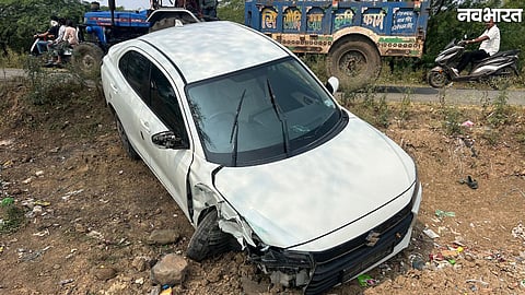 Damaged car and overturned auto rickshaw after a collision