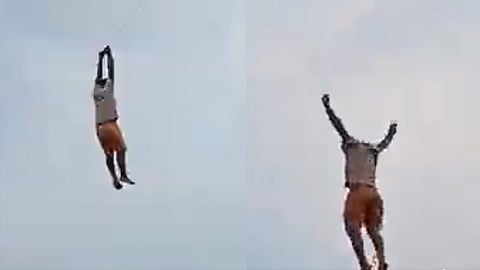 man flying kite suddenly lifted in sky In Sri Lanka