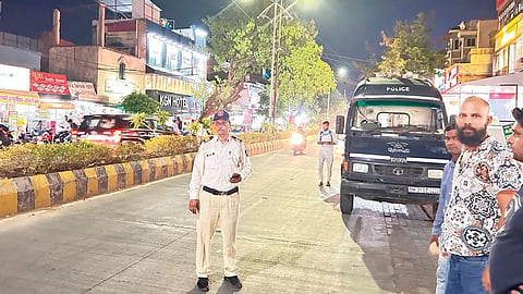 Encroachment-Police-baton-empty-road