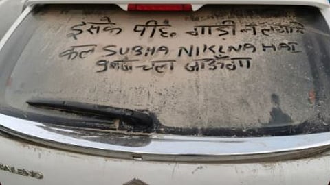 A funny parking note written on a dust-covered car is going viral on social media.