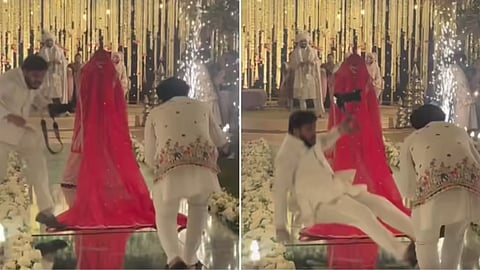 A wedding cameraman slipped during the bride’s entry but won hearts by continuing his shoot, making the video go viral.