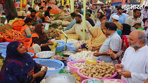 people stand with food shop in pakistan