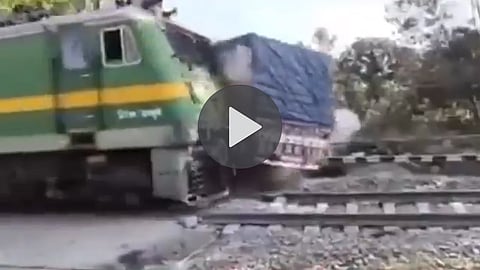 deoghar truck train collision horrifying video captures in camera at railway crossing