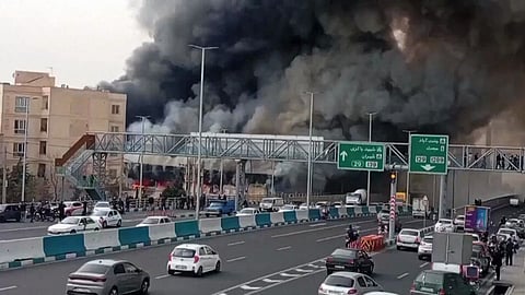 IRAN: A massive fire broke out at the Jannat Abad market in Tehran, sending thick black smoke into the sky; fire fighting teams are present at the scene.