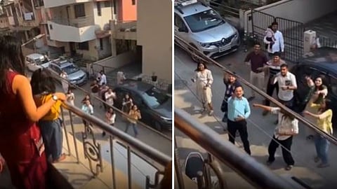 A man proposed to his girlfriend by dancing with his family below her balcony in a viral romantic video.