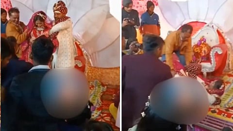 दुल्हन को स्टेज पर उठाकर ले जाने की कोशिश में दूल्हा गिर पड़ा, वीडियो देख लोग दे रहे मजेदार रिएक्शन।