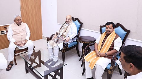 nitish kumar amit shah and nitin nabin photo goes viral political message behind chair game debate