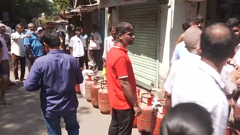 Consumers form long queues to buy gas cylinders in Mumbai's Lower Parel area