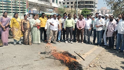 Vanchit Bahujan Aghadi (VBA) staged a massive protest in Akola against individuals named in the 'Epstein Files'. Symbols of PM Modi, Anil Ambani, and Hardeep Singh Puri burnt.