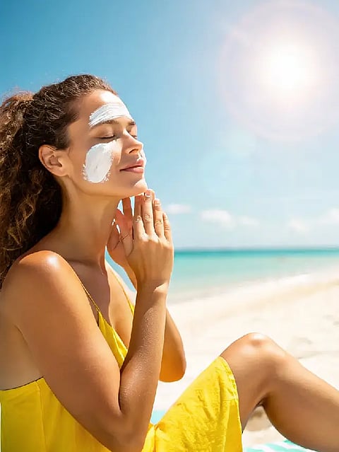 women applying sunscreen