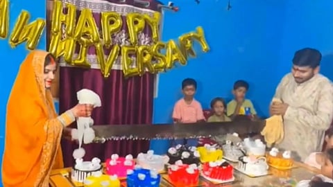 A couple cut their anniversary cake with a saw, making the unusual video go viral.