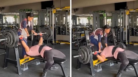 A gym accident during a 165 kg bench press was narrowly avoided thanks to a woman’s quick action.