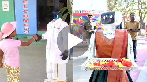 Humanoid robots welcome voters in Vellore and Gudiyattam during Tamil Nadu Assembly Elections. Robots assist in Tamil, offer chocolates, and guide voters.