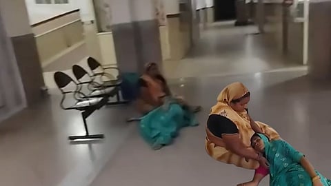 Pregnant Woman On Hospital Floor