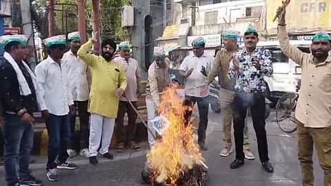Congress workers stage a protest and burn an effigy of the US President at Palsikar Square in Indore, demanding action over the deaths of Indian citizens and attacks on Indian cargo ships near the Strait of Hormuz.