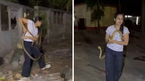 A woman fearlessly rescuing a long snake has left social media users amazed.