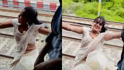 A woman was seen dancing while hanging from a train door for a reel, sparking concern over dangerous social media stunts.