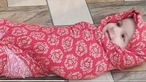 Oblivious to the world, an innocent smile on her face... the sight of this abandoned baby girl found in Nashik will melt your heart!