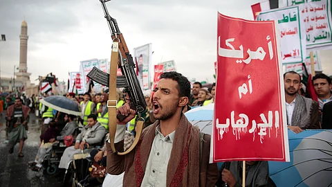 Houthi supporters attend a rally in support of the Palestinians in the Gaza Strip and against the US government designating Houthis as a terror group in Sanaa, Yemen, Friday, 'Jan. 19, 2024.