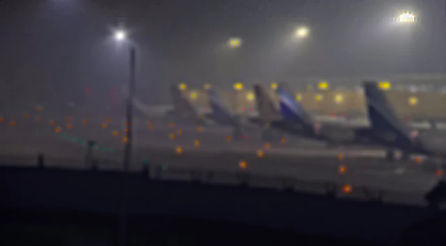 Dense fog covers the Indira Gandhi International Airport on a cold winter morning, in New Delhi on Tuesday.