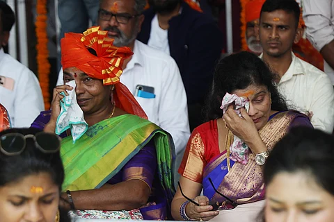 Women get emotional as they take part in the mega live screening of Ayodhya Ram Mandir Pran Prathistha at Nizam College grounds in Hyderabad. Telangana Governor Tamilisai Soundararajan also took part in this event.