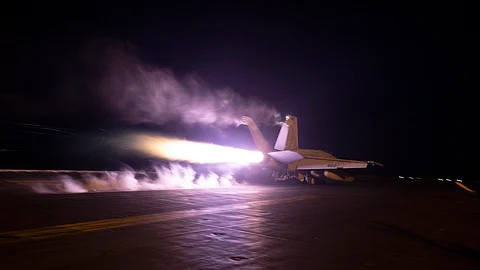 Image: An aircraft launches from USS Dwight D. Eisenhower (CVN 69) during flight operations in the Red Sea, on Jan. 22, 2024. The United States and Britain struck 36 Houthi sites in Yemen on Feb. 3, in a second wave of assaults meant to further disable Iran-backed groups in the region.