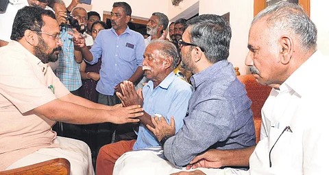 Ministers K Rajan, M B Rajesh and A K Saseendran consoling Kunjumon, father of Ajeesh who was killed by a wild elephant last week, in Wayanad on Tuesday