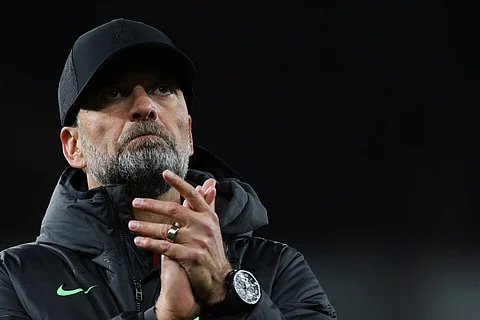 Liverpool manager Jurgen Klopp applauds at the end of the English Premier League football match between Arsenal and Liverpool at the Emirates Stadium in London on February 4, 2024.