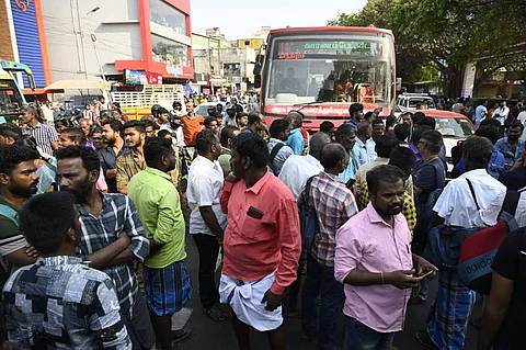 A large number of passengers staged a protest in front of the Singanallur bus stand demanding bus services to Madurai and Theni districts on Friday morning.