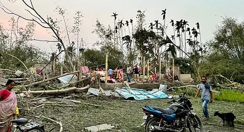 Houses are damaged and electric poles fell after a heavy strom that left at least five people dead, in Jalpaiguri, West Bengal, Sunday, March 31, 2024.