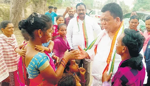 Congress Mahabubabad candidate P Balaram Naik interacts with tribal women during his campaign in the Maoist-affected Dummagudem mandal on Tuesday. 