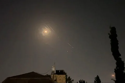 This video grab from AFPTV taken on April 14, 2024 shows explosions lighting up the Jerusalem sky during the Iranian attack on Israel.